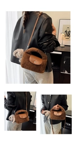Detail of brown faux fur handbag with leather flap and cute rabbit charm