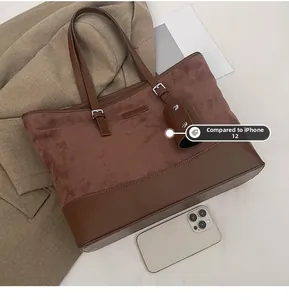 Detail view of large leopard print tote bag with phone size comparison and mini pouch