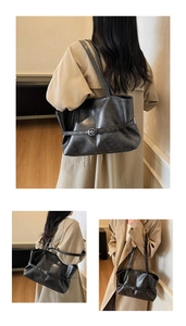 Gros plan détaillé du grand sac cabas en similicuir noir avec boucle argentée et texture