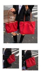 Detailed comparison of red nylon tote bags in two sizes with brown leather handles