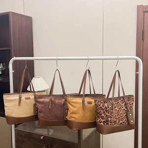 Collection of large tote bags in suede textures with leopard print and solid colors