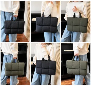 Multi-angle view of quilted puffy tote bags in black and olive green on a model