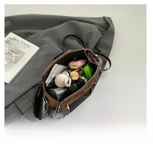 Top view showing the spacious interior of a brown canvas tote bag with daily essentials
