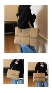 Close-up of khaki quilted down tote bag with soft padded texture and top handles