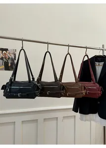 Selection of four vintage Boston style leather shoulder bags in various classic colors