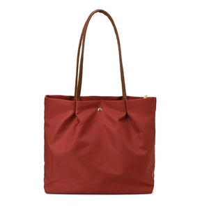 Large capacity red waterproof nylon tote bag with brown leather handles and gold buckle
