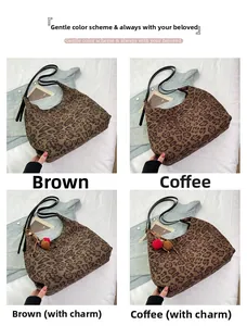 Detail view of leopard print hobo tote bags in brown and coffee tones with plush charms
