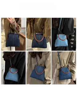 Detail showing vintage denim crossbody bag in dark blue and light blue with metal clasp