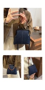 Detail of vintage denim doctor bag with metal kiss lock clasp and brown leather handle