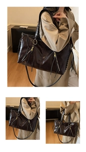 Detail der Vintage-Tote-Tasche mit Öl-Wachs-Leder und stilvollen Quasten-Akzenten