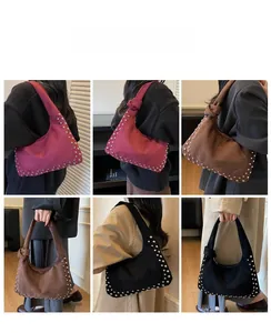 Detail shots of large tote bag with metallic rivet trim in burgundy and black leather