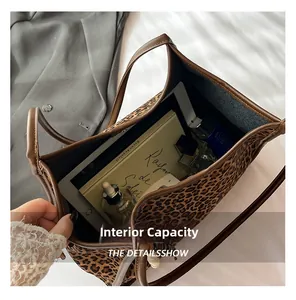 Internal view of the leopard print tote bag showing spacious capacity for iPad and books