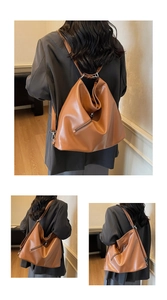 Detail of vintage brown leather hobo backpack with side zipper and silver hardware