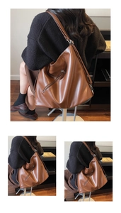Detail of a brown leather backpack showing smooth texture and diagonal zipper features