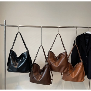 Four large capacity tote bags in black, coffee, caramel and mustard on display