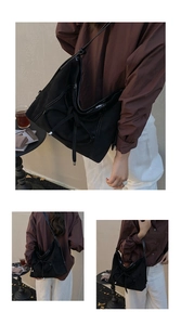Détail des surpiqûres blanches et du nœud coulissant sur le sac bandoulière en suède noir
