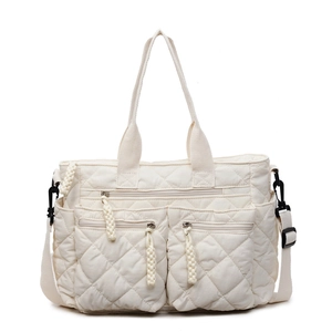 Minimalist cream white quilted tote bag with dual zipper pockets and top handles