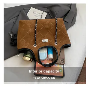 Spacious quilted tote bag showing interior storage for tablets and personal items