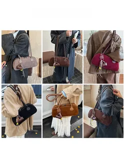 Detailed views of vintage faux suede pillow bag in multiple colors with heart tassel charm