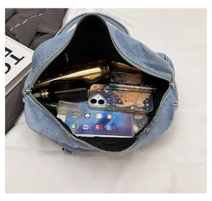 Interior view of denim tote bag showing spacious capacity for iPad and essentials