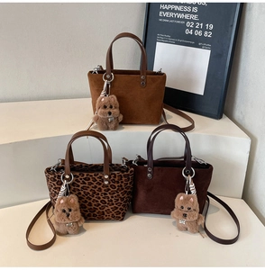 Suede mini tote bags in tan, chocolate and leopard print with plush dog charms