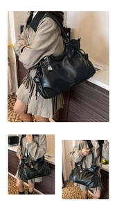 Détail du sac cabas en cuir noir avec pendentif étoile et fermoir métallique