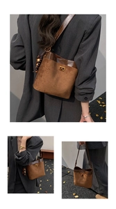 Detail of dark brown suede bucket bag featuring golden twist lock and wooden bead charm