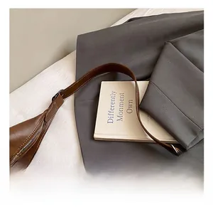 Detail of dark brown leather handle showing fine stitching and neat edge finish