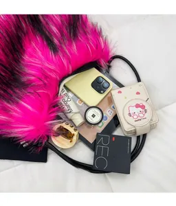 Top view of pink plush shoulder bag showing large interior capacity for phone and cosmetics