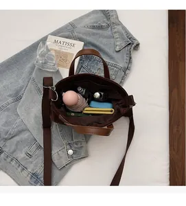 Interior detail of large canvas tote bag showing spacious compartments with daily essentials