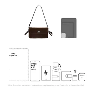 Detail showing high capacity of suede shoulder bag fitting smartphone, umbrella and essentials