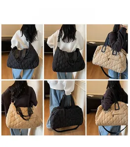 Quilted tote bag detail showcasing black and beige color options with adjustable straps