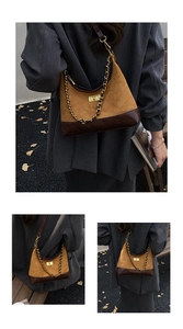 Macro detail of quilted suede surface and metallic twist lock on the crossbody bag