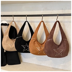Close-up of hobo shoulder bags in four colors with star-shaped metal rivet detailing