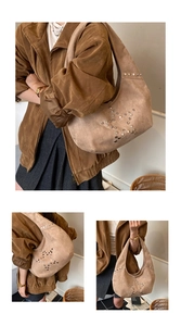 Detail of silver star rivets on light brown suede hobo bag with vintage autumn aesthetic
