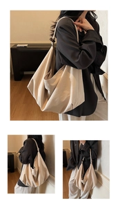 Detail view of beige canvas tote bag with dark brown wood bead accents and soft folds
