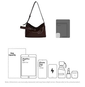 Detailed capacity view of the vintage brown leather tote bag with interior storage items