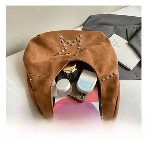 Close-up showing internal large capacity of suede star tote with silver studs