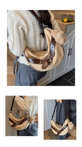 Macro detail of large leopard print crescent bag with plush bear charm and leather strap