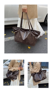 Detail view of large dark brown retro tote bag with adjustable straps and soft matte PU leather