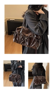 Close-up of deep brown soft leather tote bag with pleated texture and drawstring detail