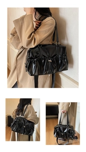 Close-up of black drawstring bowling bag with shiny PU leather texture and silver hardware