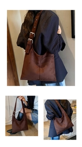 Detailed view of dark brown suede tote bag with adjustable strap and side pocket