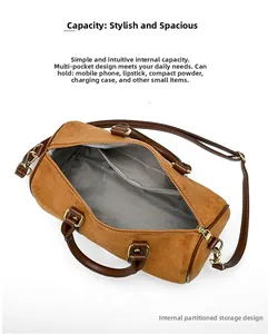 Top view of brown Boston bag showing large interior capacity and herringbone lining