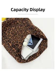 Interior view of leopard print tote bag showing large capacity for tablet and daily items