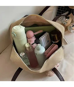 Top view of large canvas tote bag showing spacious interior with daily essentials