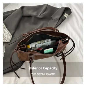 Internal view of brown suede tote bag showing spacious capacity for daily essentials
