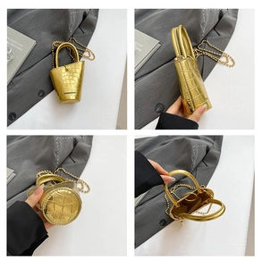 Close-up of golden croc-effect mini bucket bag with metallic chain and fashion text