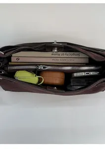 Deep brown suede tote bag interior showing three compartments and large capacity