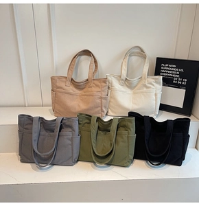 Collection de cinq sacs fourre-tout en velours côtelé en kaki, blanc, gris, vert et noir